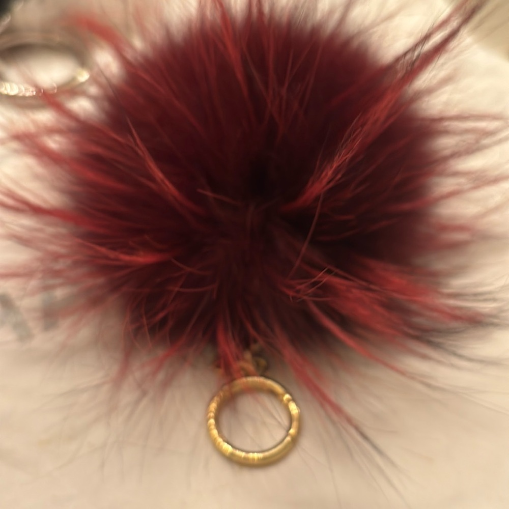 Like New Michael Kors burgundy  poof/key ring 💟